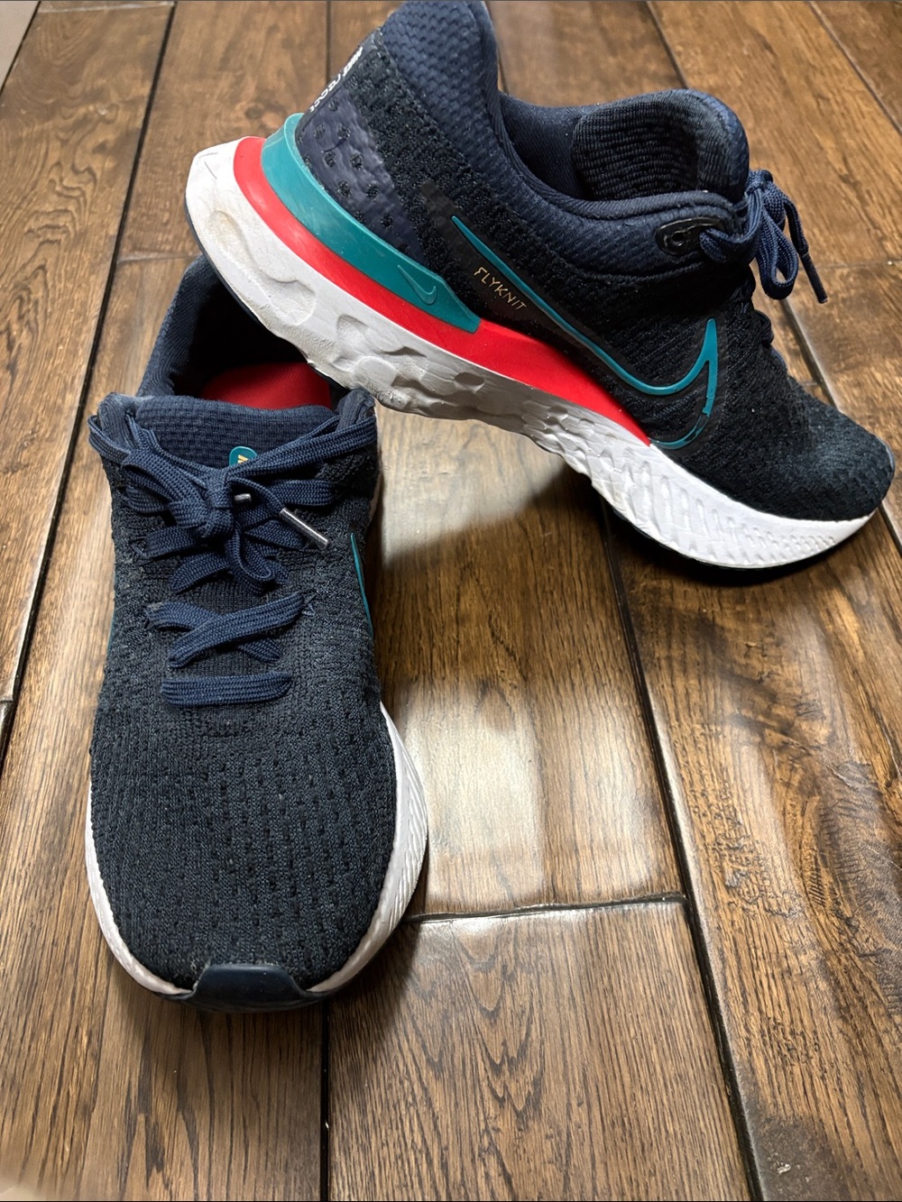 Nike Flyknit Runner - Navy with Teal and Red Highlights